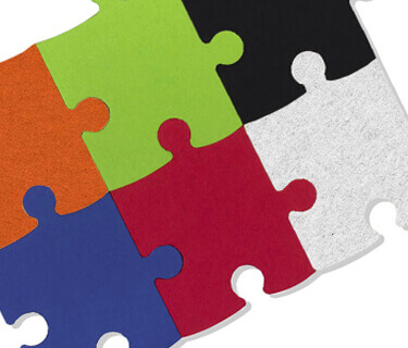 Stacked jigsaw sound absorbers with felt surface in various colours