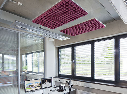 Sound absorbers in the office and call centre Sound absorbers in a hanging cassette above a workplace in an office