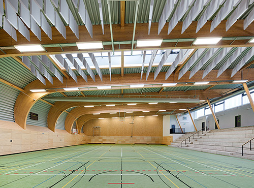 Sound absorbers on the ceiling of a sports hall Free-hanging sound absorbers under the hall ceiling lower the noise level and reduce reverberation.