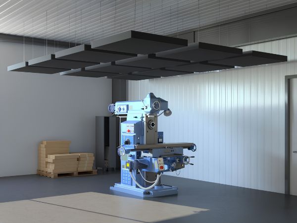 Acoustic absorber with HANGER above a machine