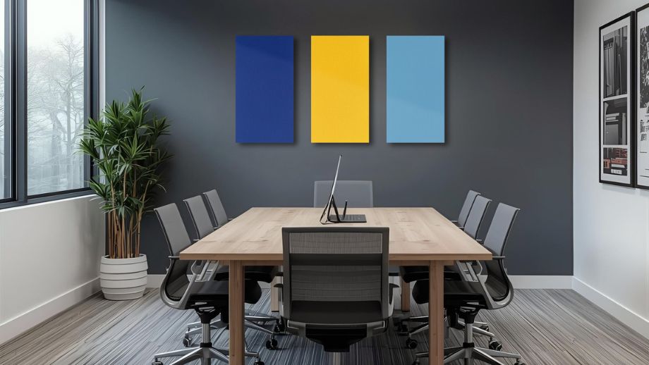 Royal blue, sunny yellow and sky blue acoustic absorbers with felt surface in a meeting room