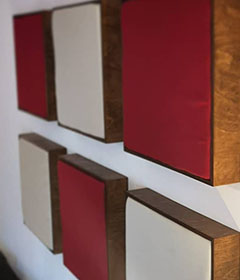 Acoustic frames in different colours on the wall